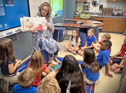 Christi Coleman reading to students.