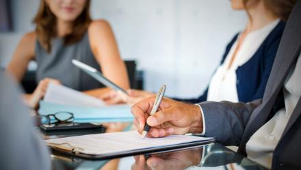 STOCK PHOTO - Board meeting taking notes