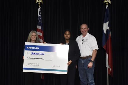 student holding check