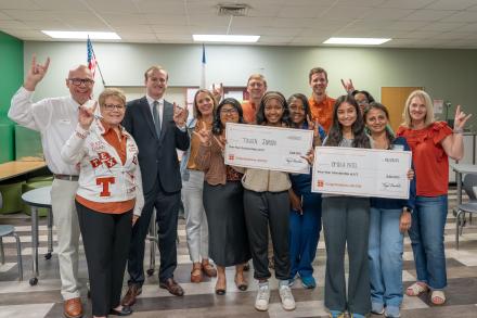 students celebrating with scholarships