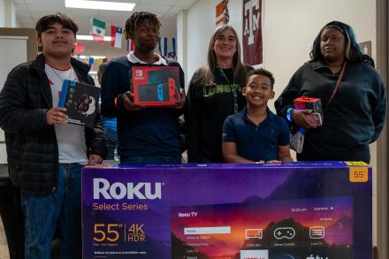 Students holding prizes
