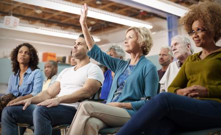 STOCK PHOTO - Diverse group of adults attending a community meeting