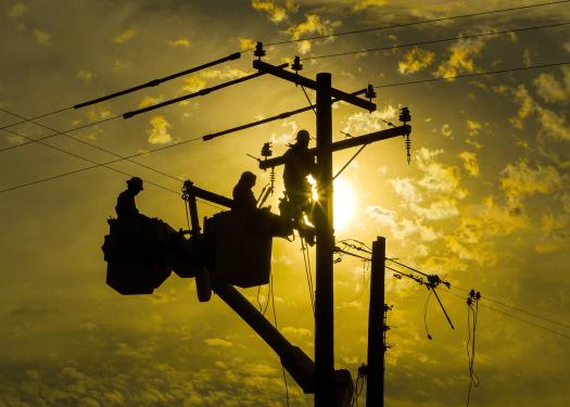 STOCK PHOTO Men Working On Power Lines.