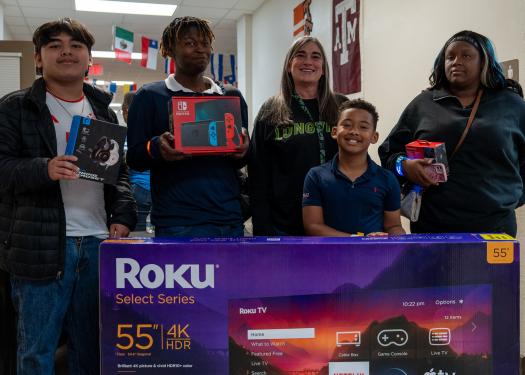Students holding prizes
