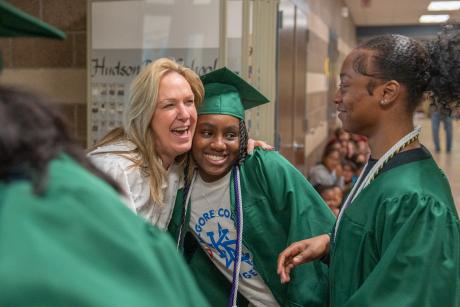 student hugging teacher
